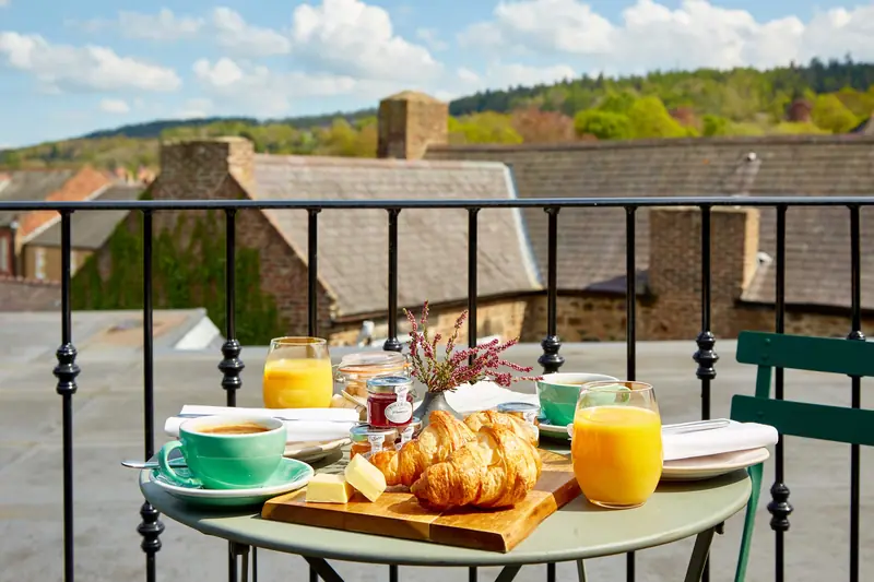 Breakfast for two on a balcony overlooking the rooftops of Hexham